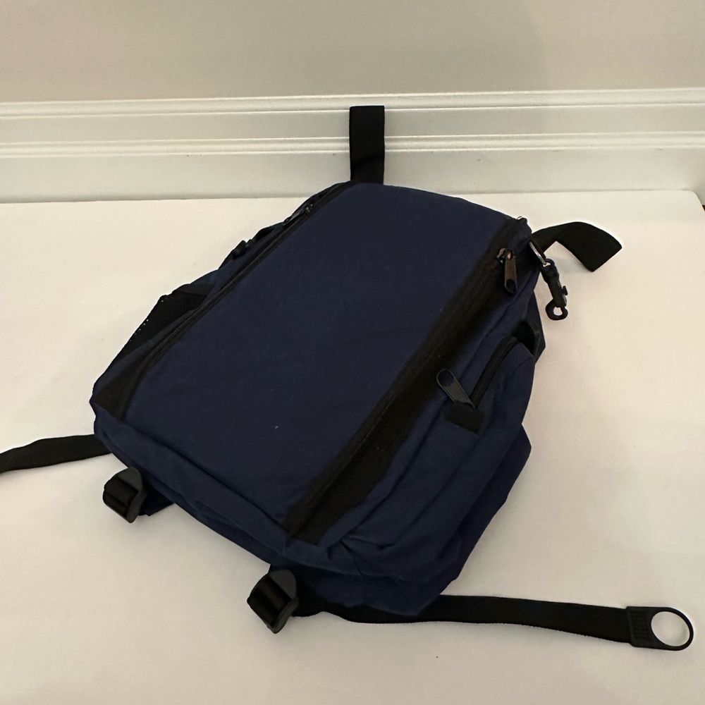 Brand new hiking backpack with gold out seat pad navy colour and black